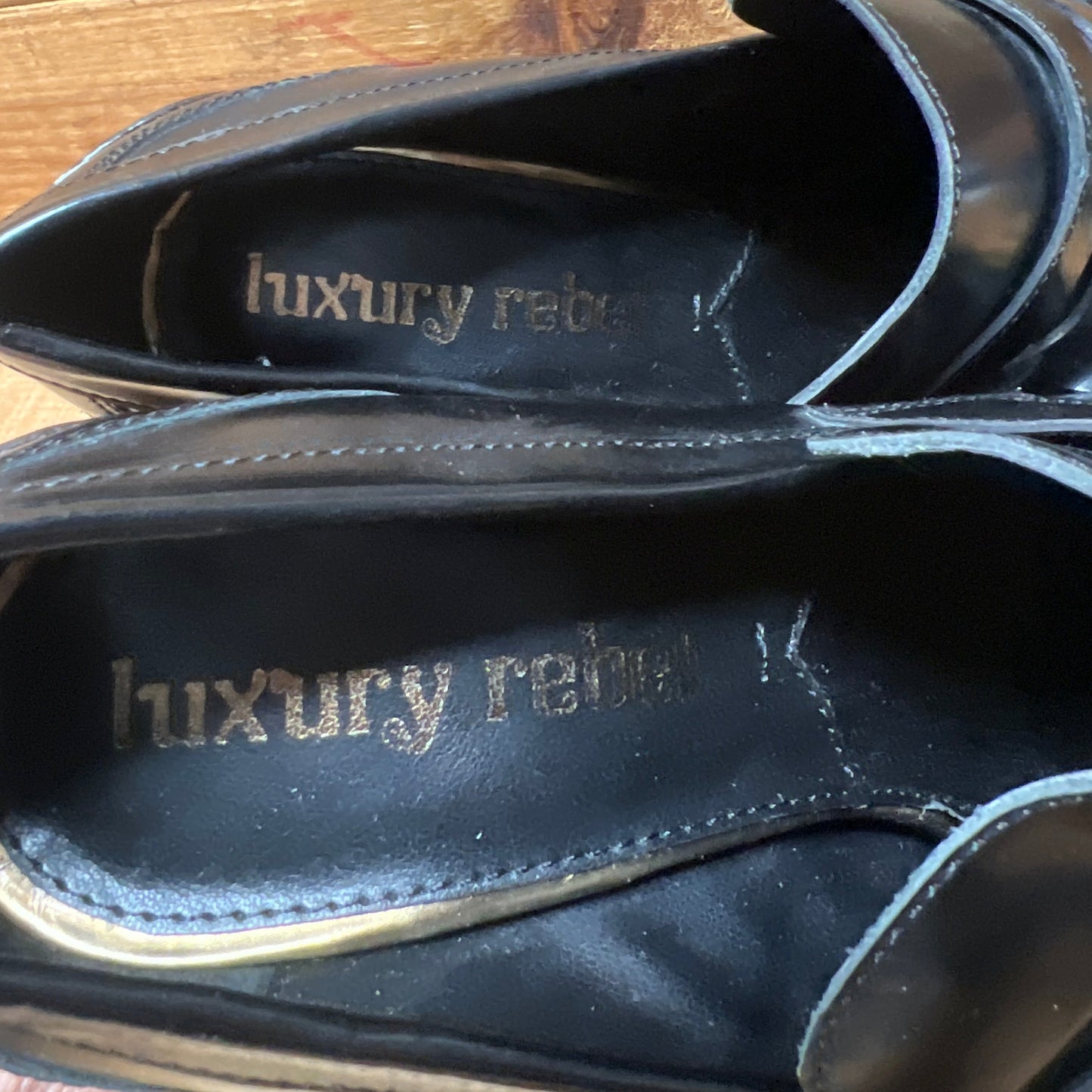LUXURY REBEL Women's High Healed Gold-tipped Kiltie Penny Loafer Pump. 37EU/US 6.5-7 Black Polished Leather